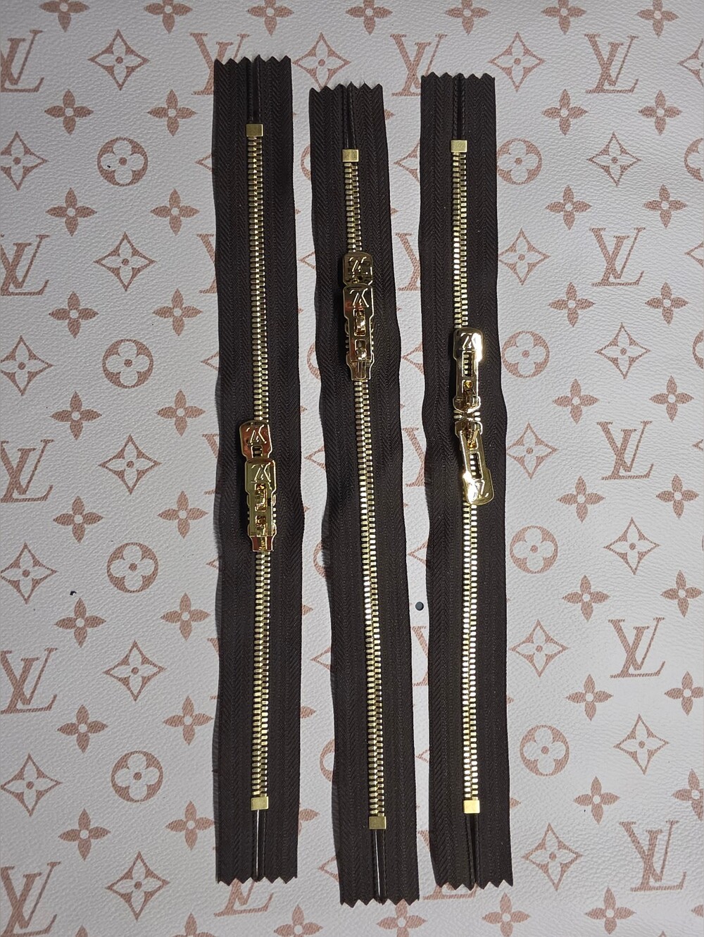 Louis Vuitton Brown Zipper Pulls with Gold Teeth - Designer Style